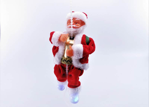 Mikołaj wspinający się po łańcuszku na baterie, grający 